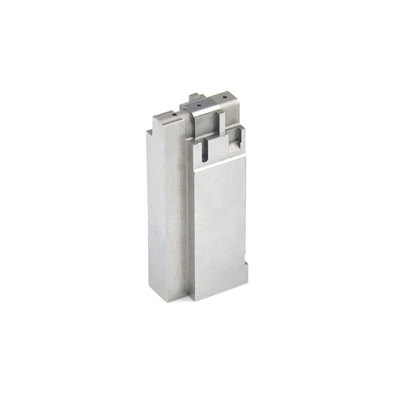 Precision machined rectangular metal block with stepped top details and small holes